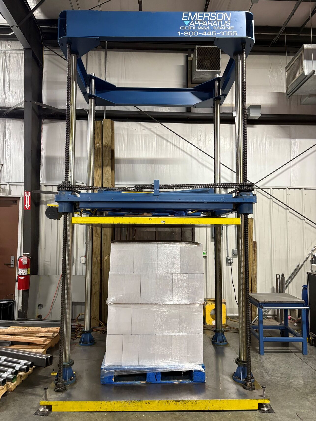 Compression test being performed on a stretch wrapped pallet load using an Emerson Apparatus compression machine at gh Testing to evaluate packaging strength and stacking performance for distribution.
